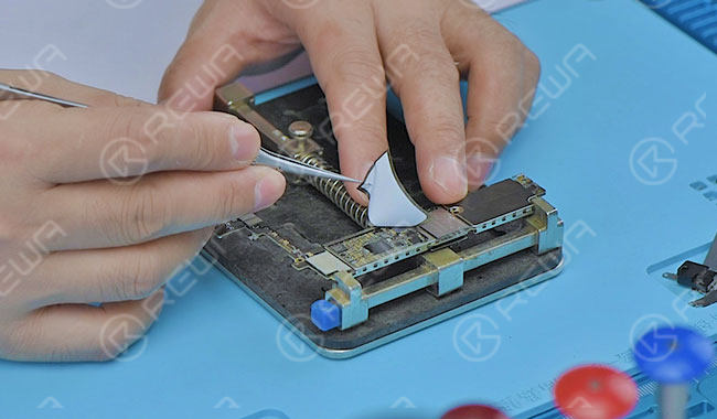 iphone frozen screen issue - logic board repair solution Take out the logic board and tear off the shield sticker.