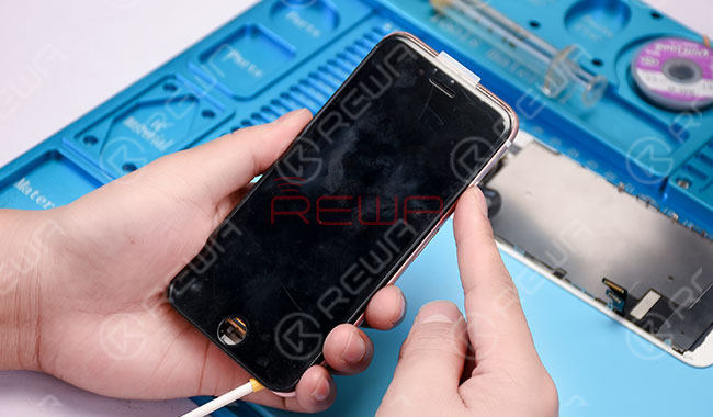 Disconnect the power supply and detach the display assembly. Replace with a new display assembly. Connect the phone with the DC Power Supply and power up. The phone still goes with no display