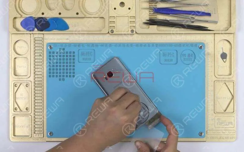 First we need to heat the back glass with the pre-heating pad. Then apply a suction cup to the back glass. Lift on the suction cup carefully. There should be a tiny gap between the back glass and the mid-frame. Insert a blade into the gap. Then insert the plastic pry piece into the gap.Slide back and forth along edges of the screen to slice through the adhesive holding the back glass in place. If the slicing becomes difficult, you can also apply some alcohol to the gap for smooth operation.