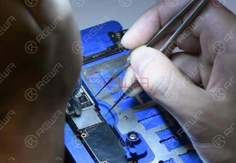 Now we can solder the NAND flash chip and a new WiFi module onto the board.Apply some Paste Flux to the bonding pad. Get the NAND flash chip in position. Make sure you put it in the right direction. Solder with the QUICK 990AD Hot Air Gun.