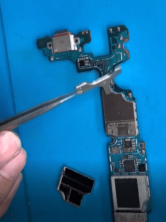 samsung s10 plus not charging issue repair Remove the shielding cover on the motherboard