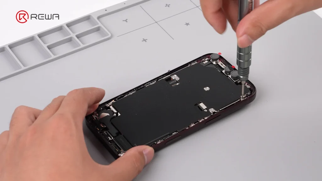 using a screwdriver to open iPhone 18 Pro for teardown